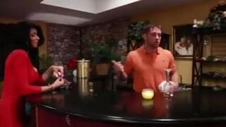 Sexy brunette with fake boobs seduces the bartender to fuck her on the couch