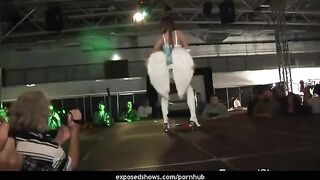 A young hot girl learns to striptease on the pole in a steamy class