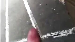 The guy jerks his dick in the street. Public handjob naked