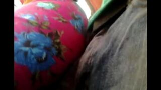 A man is rubbing his cock through the cloth on a bus with random women