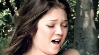 Two cute girls are having fun during a picnic in the park, getting intimate