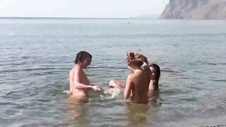 Nudist beach: a man and woman are completely naked on the beach