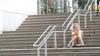 A girl walks outside without panties, feeling a bit naughty