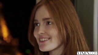The guy carefully licked the red hair of a passionate girl on the bed