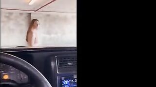 Redhead babe flashes and fucks in the public garage, getting cum on her face