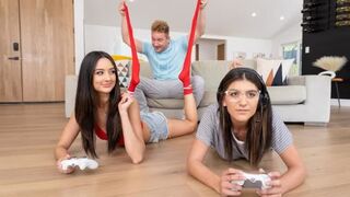 A hot chick is fucking her boyfriend in the gaming room with roommates