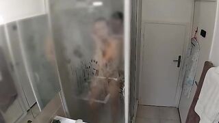 A couple gets caught in a passionate moment during a shower, unable to stop