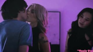 An Asian girl is fucking with a European guy on the couch