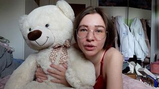 A cute girl has fun with her best friend, a cuddly teddy bear