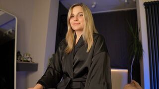 A hot woman is hiding a big surprise under her satin robe