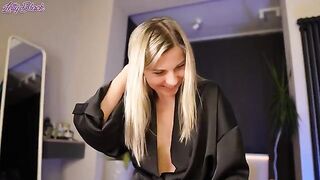 A hot woman is hiding a big surprise under her satin robe