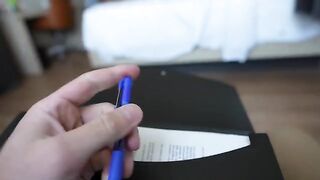 A girl with big tits is sucking the cock of her coworker in a hotel room