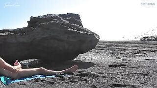 A girl has a sensual sex show on the naked beach