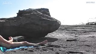 A girl has a sensual sex show on the naked beach