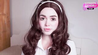 The girl in the suit of a doll is subject to rough sex