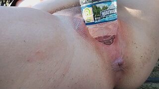 A woman reached the peak of pleasure while indulging in self-pleasure outdoors