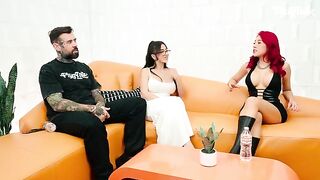 Two girls are having fun with a guy in an interview setting