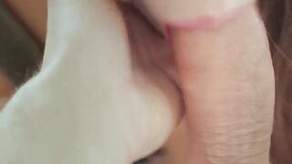 A woman is having sex with her husband while sitting and drinking coffee in the morning